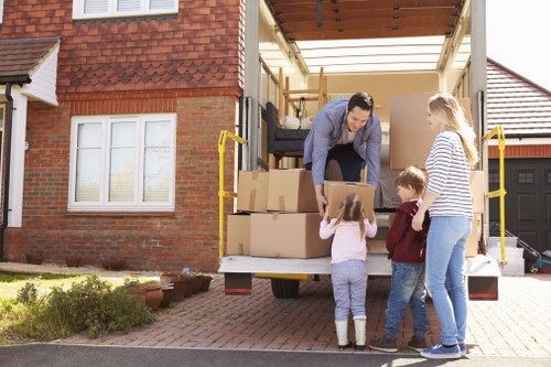 Packed office furniture and equipment prepared for a business move