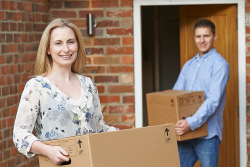 Moving van and professional movers during a local house removal