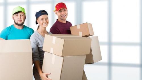 Boxes, furniture, and moving supplies arranged for a South Lambeth home move