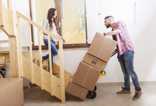 Loading furniture and boxes for a student move near South Lambeth flats