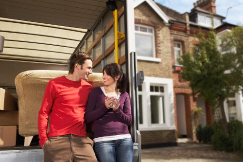 Furniture loading into a removals van on a busy South London street